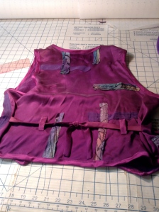 Vest back.  The vertical strips cover the previous stitching holes